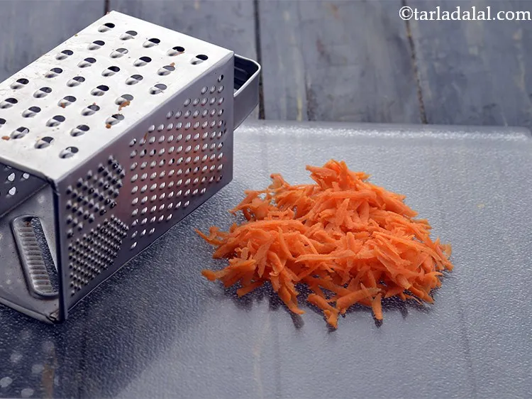 Step 6 – Grate the carrot using a grater and keep aside.