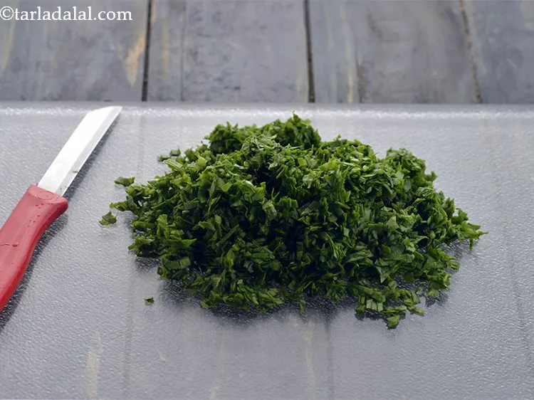Step 4 – Finely chop the spinach leaves using a sharp knife.