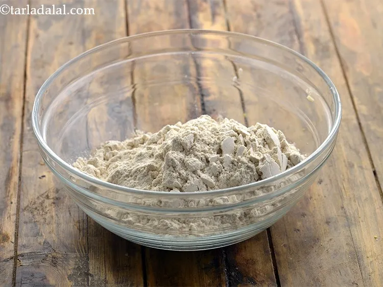 Step 4 – For the dough of <strong>paushtic roti</strong>, in a deep bowl take gehun ka atta.