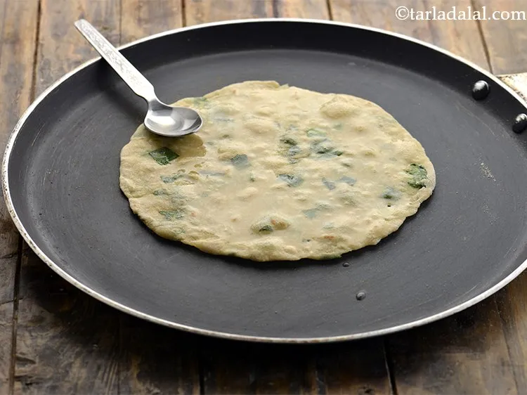 Step 17 – Apply &frac14; tsp of oil, flip and cook the other side.