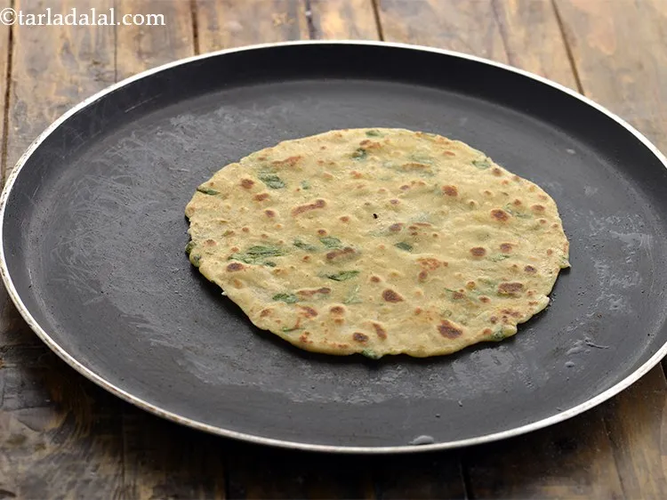 Step 18 – Apply &frac14; tsp oil on the other side and cook till the <strong>potato roti</strong> has …
