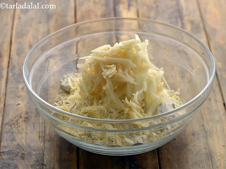 Step 6 – Add the grated potatoes.