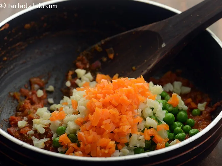 Step 18 – Add carrots. This is optional. It just increases the nutrient quotient of the bhaji making …