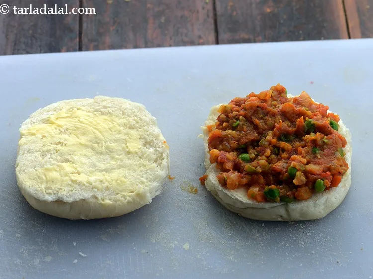 Step 27 – Spread one portion of the bhaji.