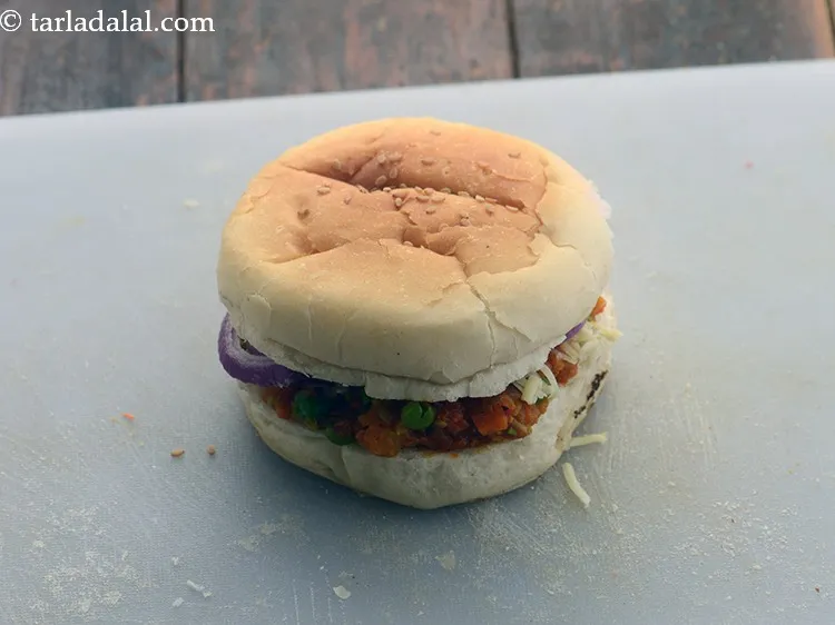 Step 30 – Place the upper half of the bun over it with the buttered side facing downwards …