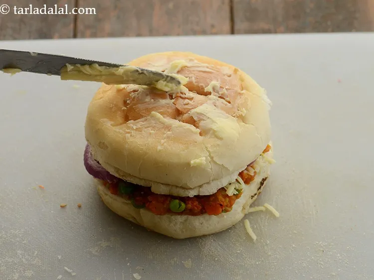 Step 31 – Brush some more butter again on the top of the bun and keep aside.