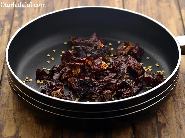 Step 2 – To make the <strong>pav bhaji masala at home</strong>, in a broad non-stick pan, take the …