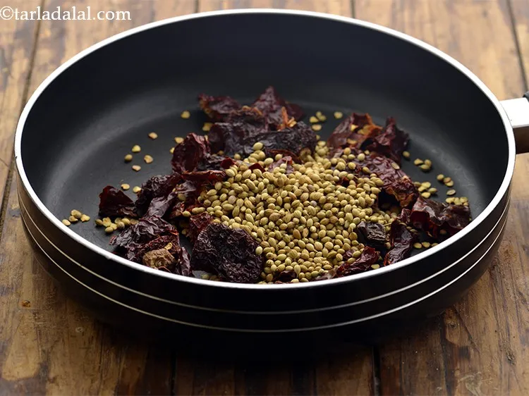 Step 3 – Add coriander seeds. Don&rsquo;t forget to pick and clean the spices before adding.