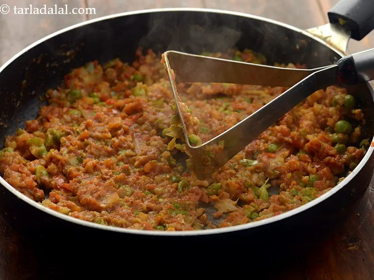 Step 13 – Do mash it very well with a potato masher.
