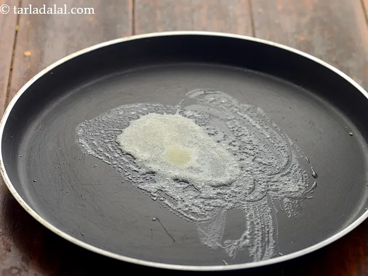 Step 17 – To toast the ladi pav, heat a non-stick tava (griddle) and add little butter. You …