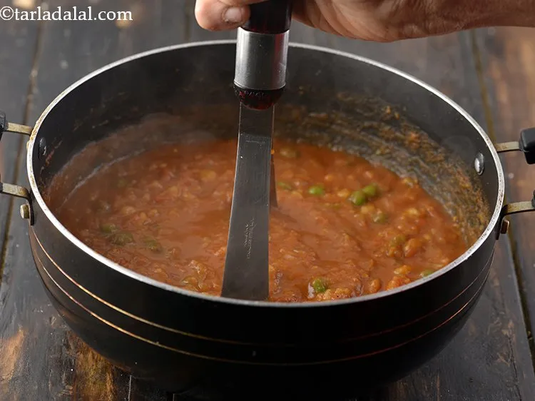 Step 19 – Mashing it with the help of a potato masher till everything is chunky yet smooth.