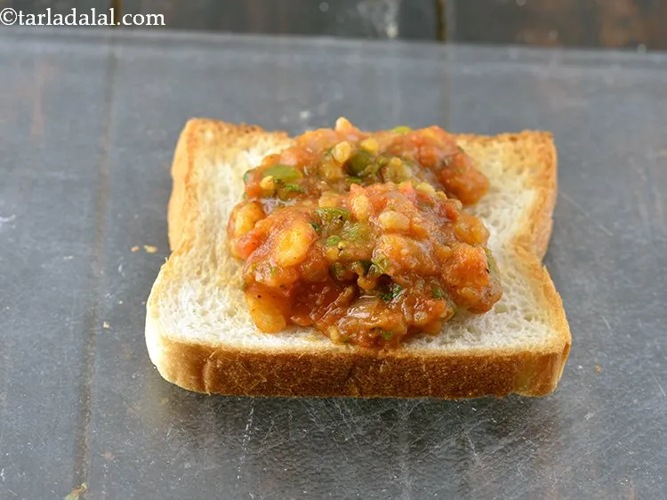 Step 23 – Place &frac14; cup of the prepared bhaji.