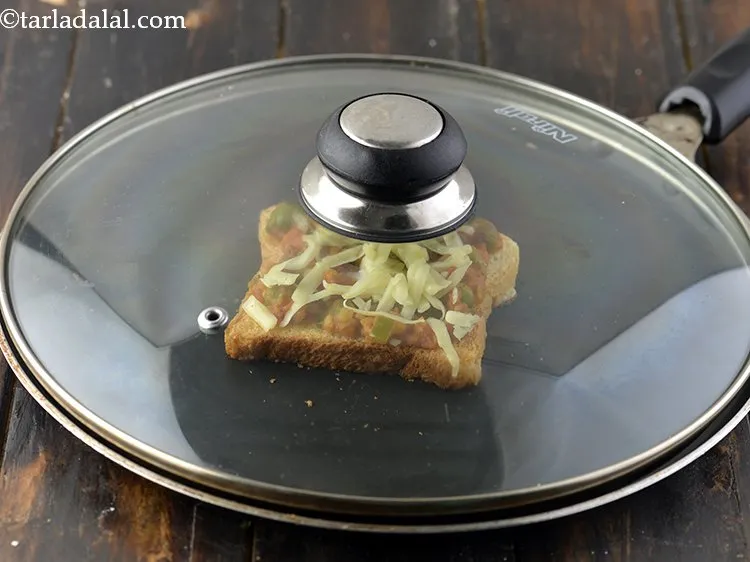 Step 29 – Cover with a lid this will help in creating a steam and melting the cheese.