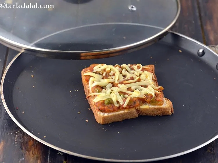 Step 30 – Cook on a medium flame for 3 minutes or till the cheese melts.