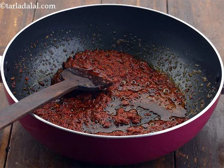 Step 11 – When the seeds crackle, add 2 tbsp of red chilli paste and saut&eacute; on a …