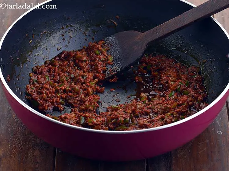 Step 12 – Add the capsicum and saut&eacute; on a medium flame for a minute.