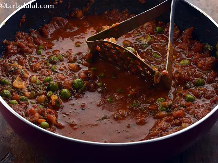 Step 21 – Mash well using a potato masher.