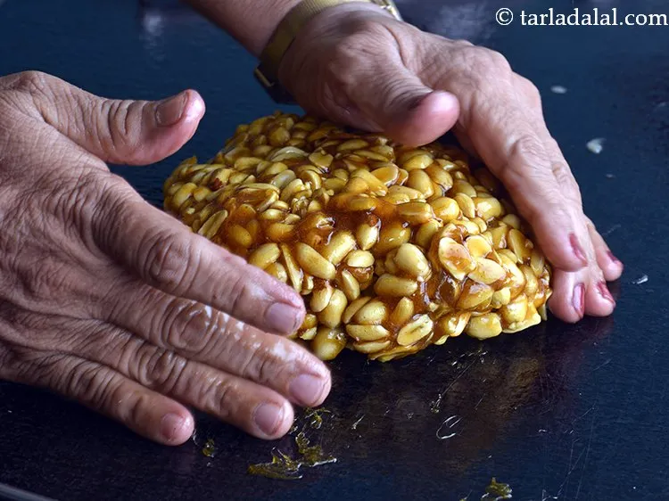 Step 12 – Pat the mixture, with greased hands.&nbsp;