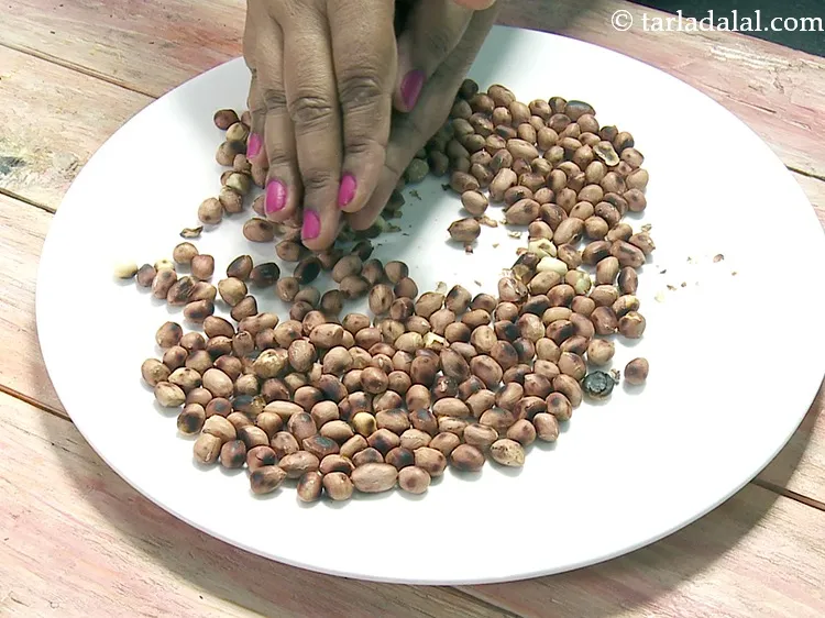 Step 26 – Remove the skin of the peanuts by rubbing the peanuts between your hands to separate …