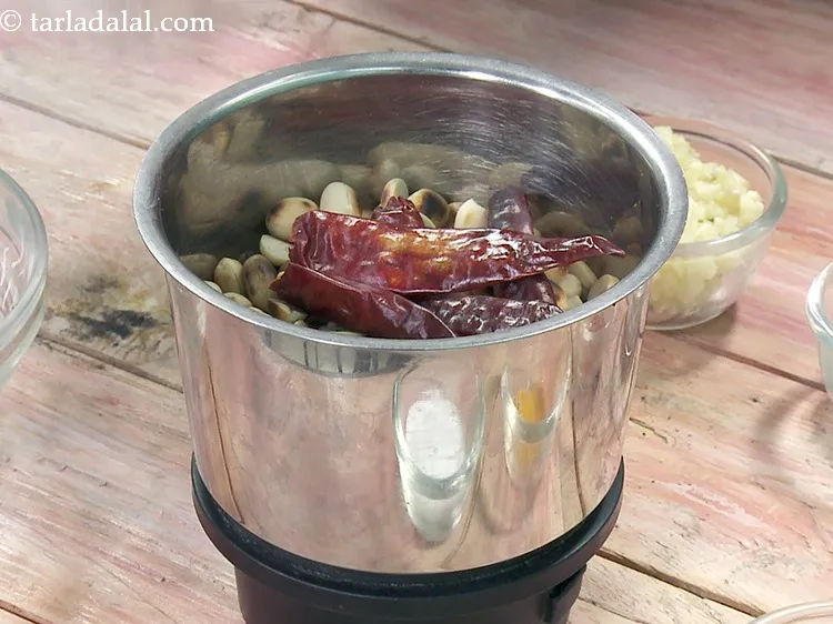 Step 29 – Add 4&nbsp;<a href="https://www.tarladalal.com/glossary-whole-dry-kashmiri-red-chillies-kashmiri-mirch-kashmiri-lal-mirch-332i">whole dry kashmiri red chillies</a>.&nbsp;