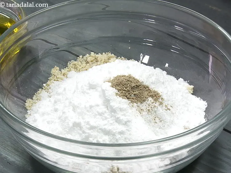 Step 10 – Add cardamom powder. There are many variations to <strong>peanut ladoo</strong>, here we have kept them …