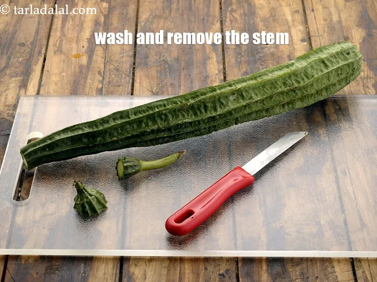 Step 4 – Wash and remove the stem from the ridge gourd.