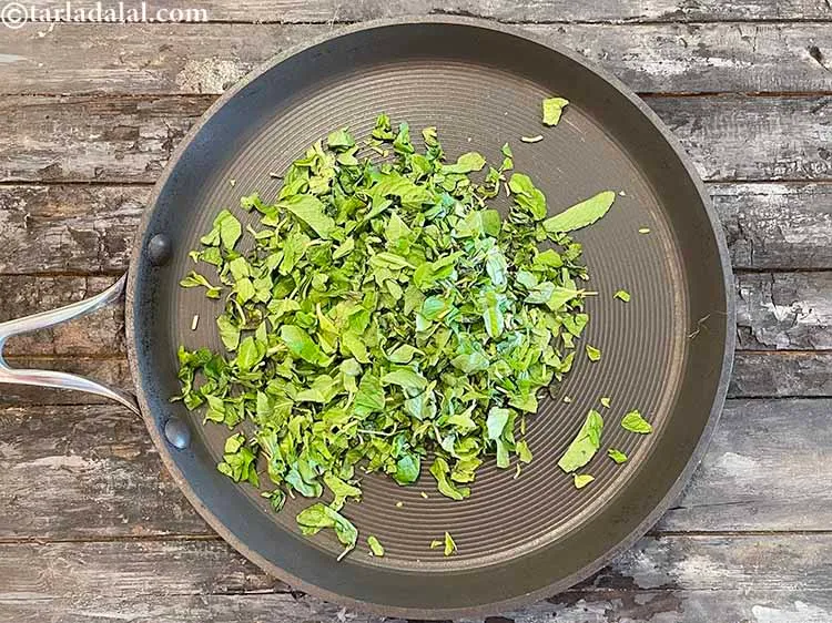 Step 2 – Put the mint leaves on a hot non stick pan.