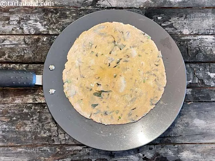 Step 15 – Spread a little ghee and cook the roti.