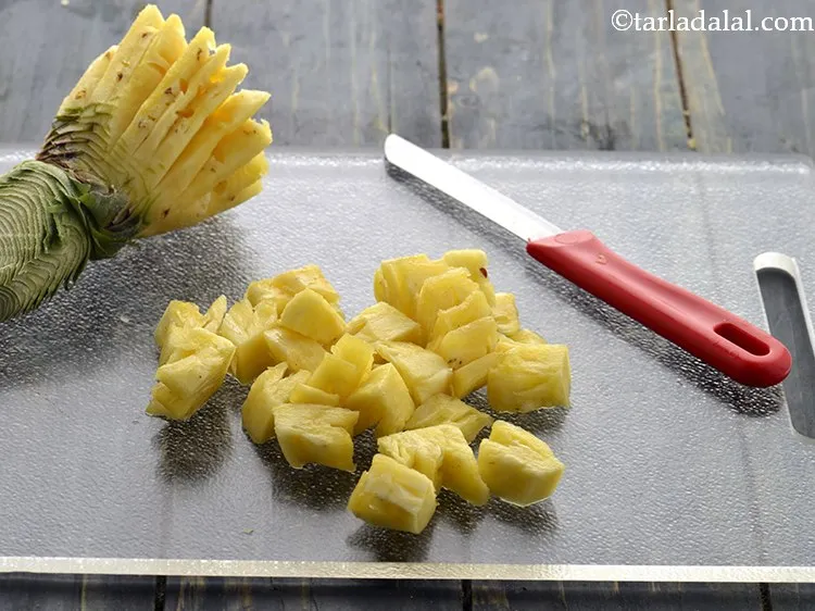 Step 11 – Add 3/4 cup&nbsp;<a href="https://www.tarladalal.com/glossary-pineapple-cubes-91i">pineapple cubes</a>.
