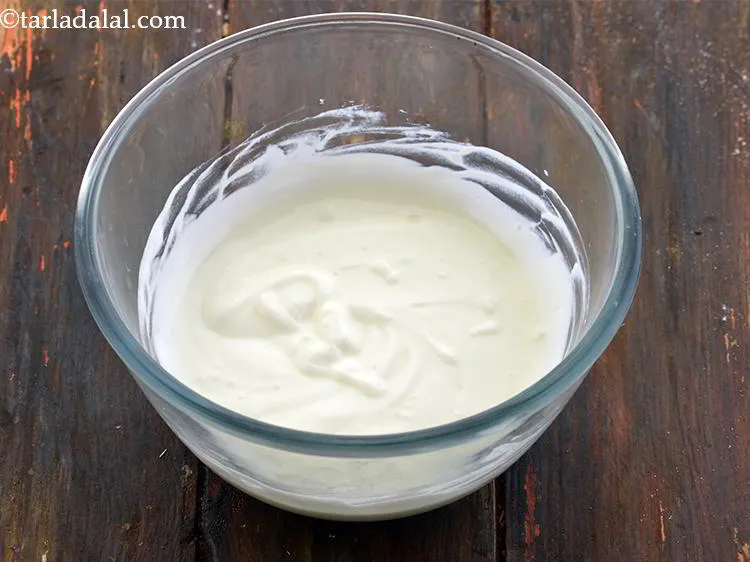 Step 2 – To make <strong>Pineapple Raita</strong>, first take a deep bowl and add the curds to it. …