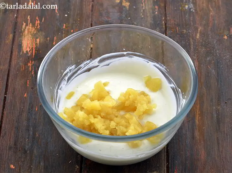 Step 4 – Now, add the chopped canned pineapple into the curd. We are using canned pineapple because …