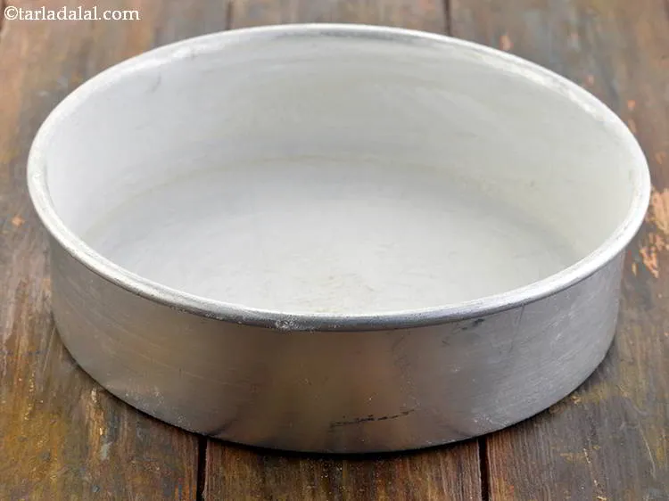 Step 4 – Shake and tap the tin to remove the excess flour and keep aside