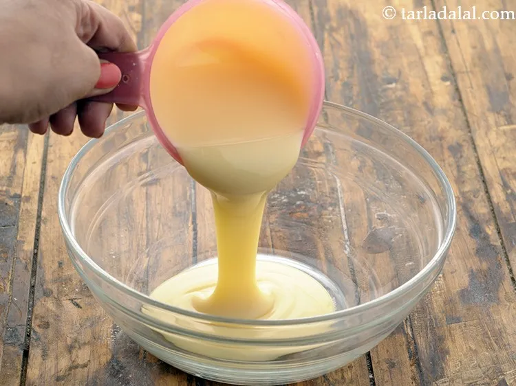 Step 8 – To combine the wet ingredients, in a deep bowl add condensed milk