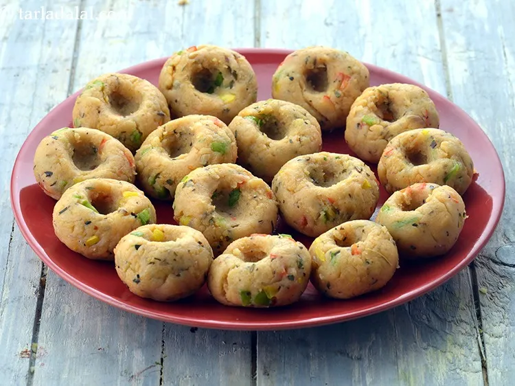 Step 21 – Roll each portion into a ball making a depression in the center.