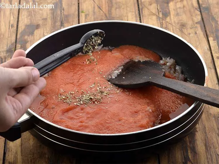 Step 18 – <meta charset="UTF-8" />Add the oregano. If you wish you can also add mixed herbs.&nbsp;