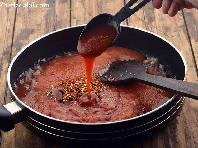 Step 18 – Add the tomato ketchup. This gives a little colour and sweetness to the sauce.&nbsp;