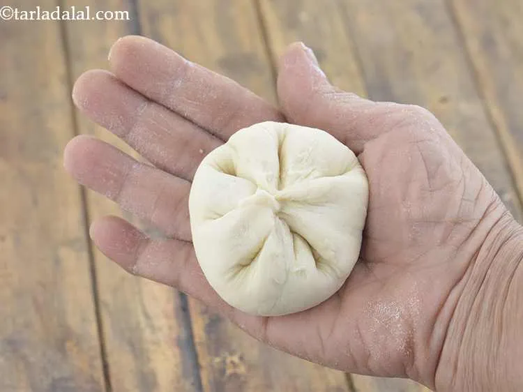Step 19 – Discard the extra dough and roll it between your palms into a ball. Make sure …