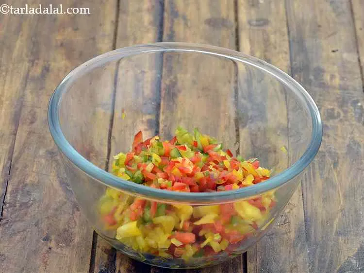 Step 10 – In a bowl, add finely chopped colored capsicum. You can even use any single color …