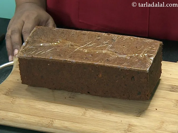 Step 31 – Cool the <strong>fruit cake </strong>slightly, loosen the edges using a knife and demould it by …