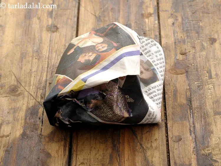 Step 17 – The kand poha is packed in a newspaper. Good to see that the use of …