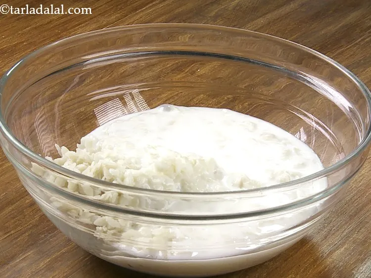 Step 9 – Add the prepared curd -water mixture.