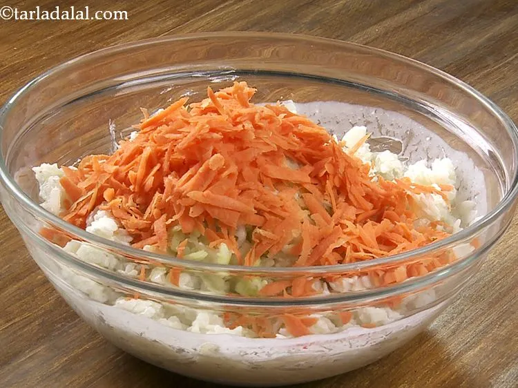 Step 14 – Add the grated carrot. These vegetables provide a nice bite and flavor to the poha …