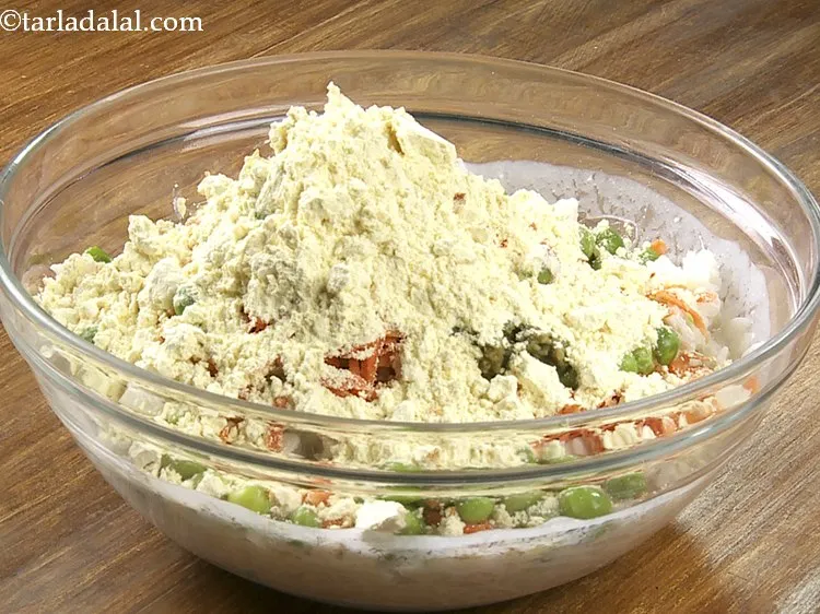 Step 20 – Add the besan. Bengal gram flour helps in binding together all the ingredients.