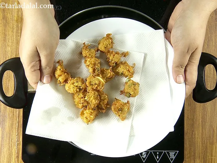 Step 33 – Drain the Poha Bhajias on an absorbent paper and keep aside.