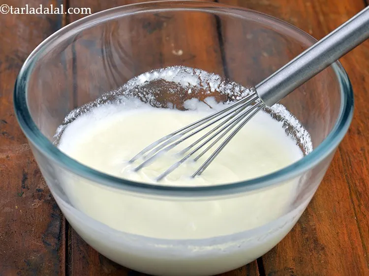 Step 7 – Add &frac12; cup of water, whisk well and keep aside.