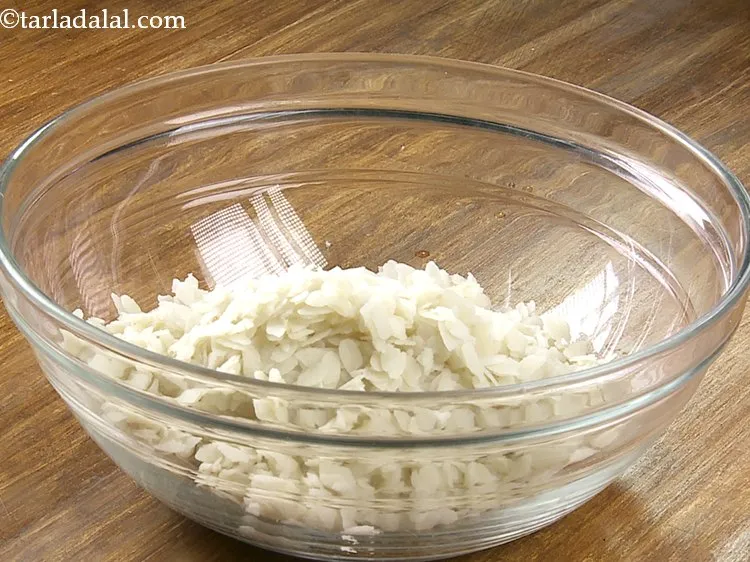 Step 8 – Transfer the soaked and drained poha in a deep bowl.