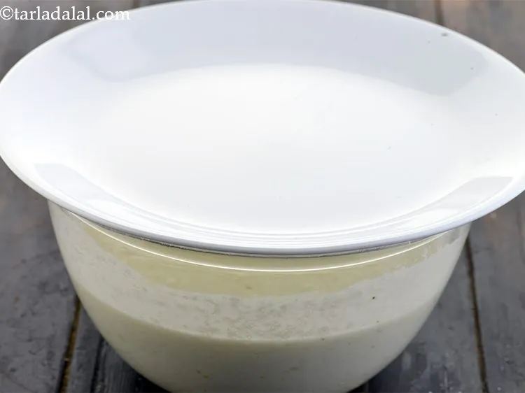 Step 11 – Cover and keep aside for 10 minutes so that the <em>rava </em>and <em>poha </em>absorb the …