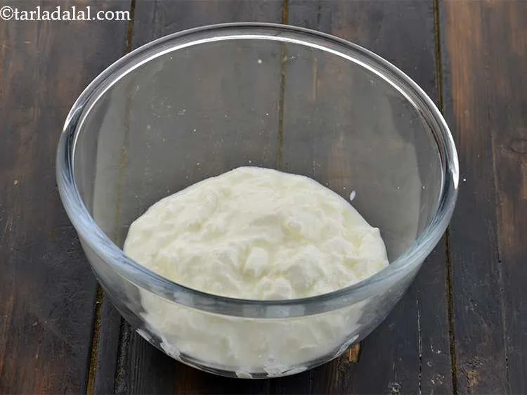 Step 3 – Take a deep bowl and add the curd to it. Curd makes the poha dhokla …