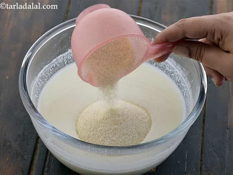 Step 6 – To this, add the semolina. Semolina is also called <em>sooji</em> or <em>rava</em>. <em>Rava </em>acts as …