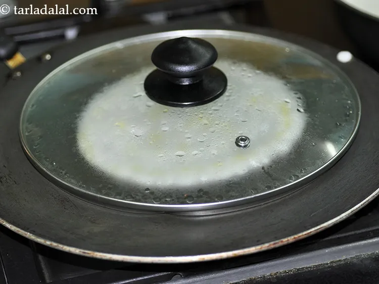 Step 30 – Cover with a lid and cook on a medium flame for 1 to 2 minutes.